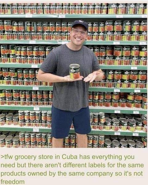 This meme is a photo of a man in a grocery store, holding up a can of beans with a label that says "Product of USA". The text above and below the image reads "When you realize the product of USA is actually made in Cuba". The image is humorous because it pokes fun at the idea that a product from the United States is actually made in Cuba, implying that the US is not as independent as it claims to be.